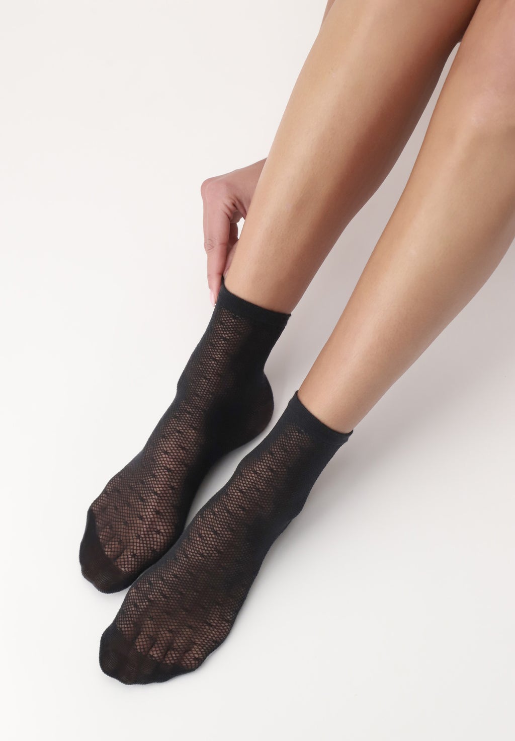 OroblÌ_ Eco Sneaker Sock - Black environmentally friendly fashion quarter high ankle socks made of recycled yarn with a semi-sheer micro-mesh base, woven all over spot pattern, plain under foot, thin cuff and shaped heel.