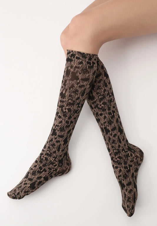 OroblÌ_ Savannah Sock - Soft beige fashion knee-high socks with a woven black leopard print style pattern.