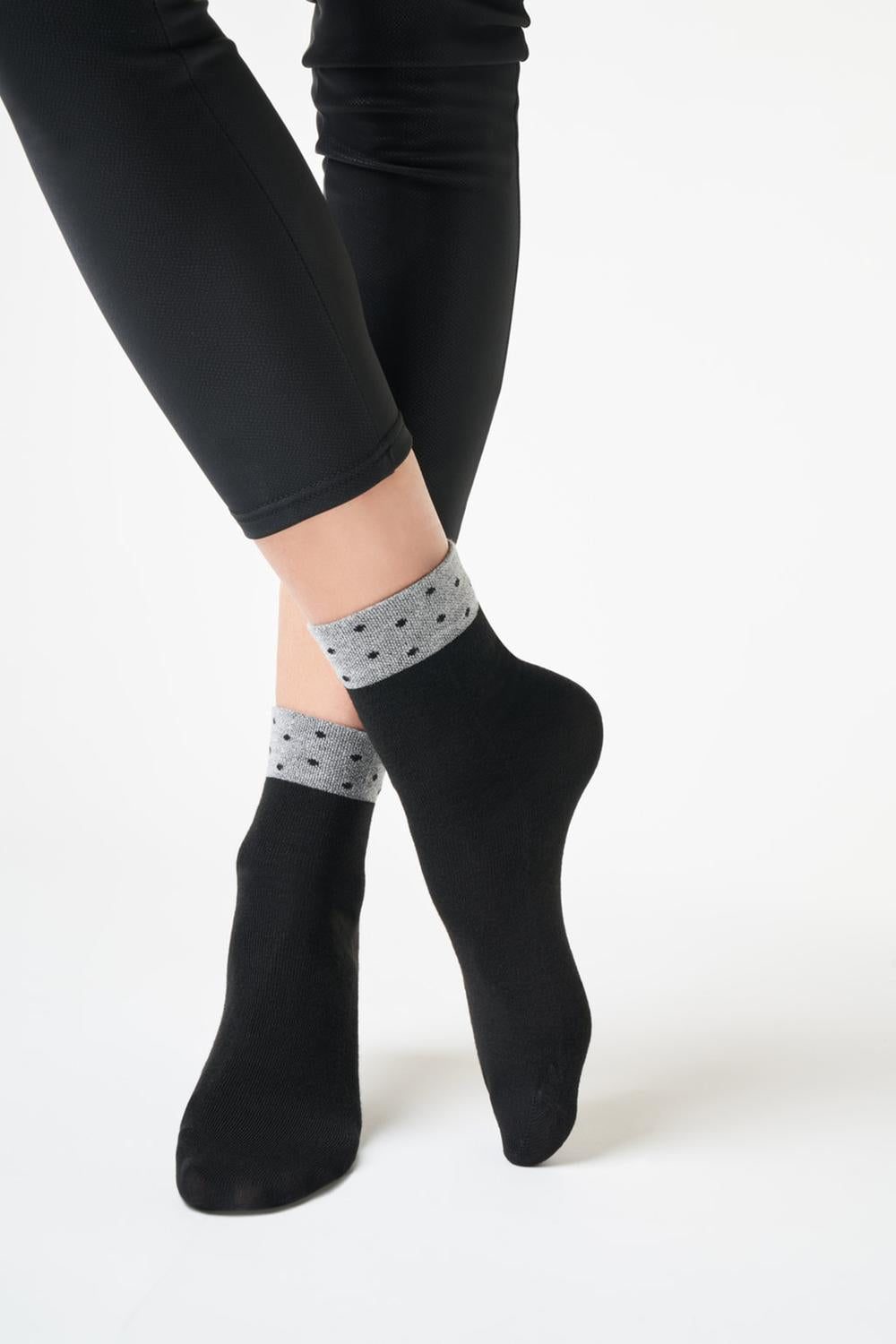 SiSi Pois Calzino - Soft black viscose mix tube ankle socks with a sparkly silver cuff with black polka dot pattern and flat toe seam.