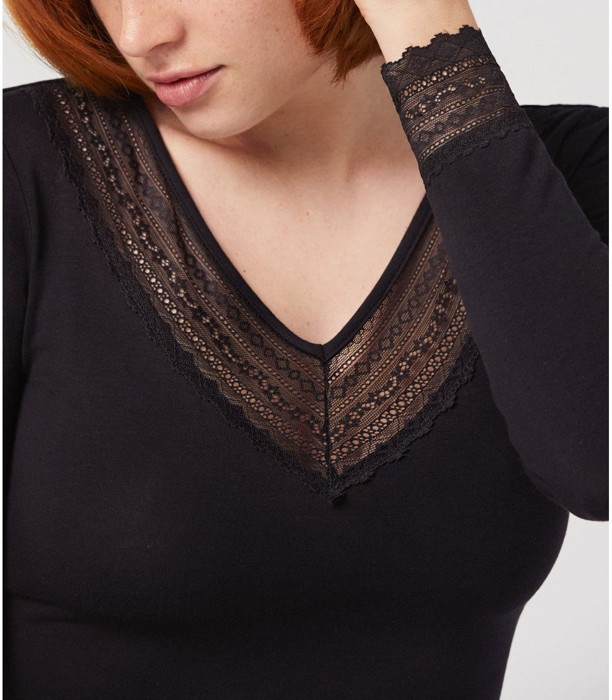 Ysabel Mora 19250 Lace Trim Top - Soft and warm long sleeved black vest top with a lace trim v-neck and lace trim cuffs.